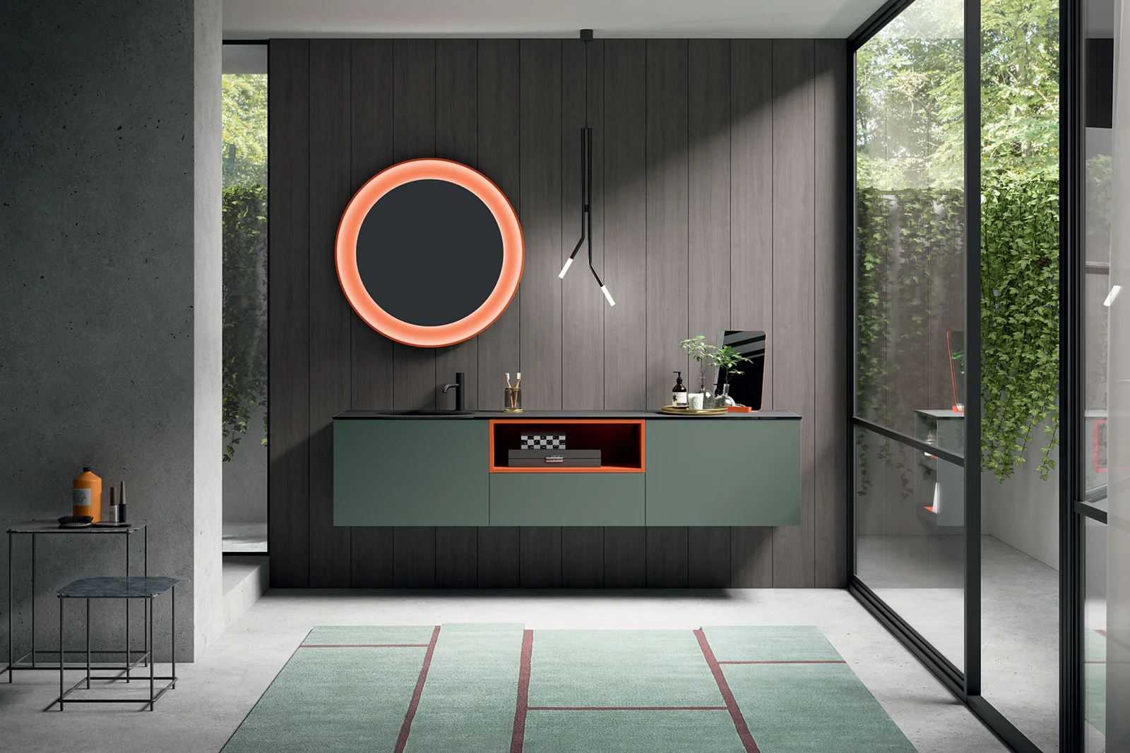 Mobile bagno CartaBianca verde sospeso con specchio circolare dalla cornice arancione.